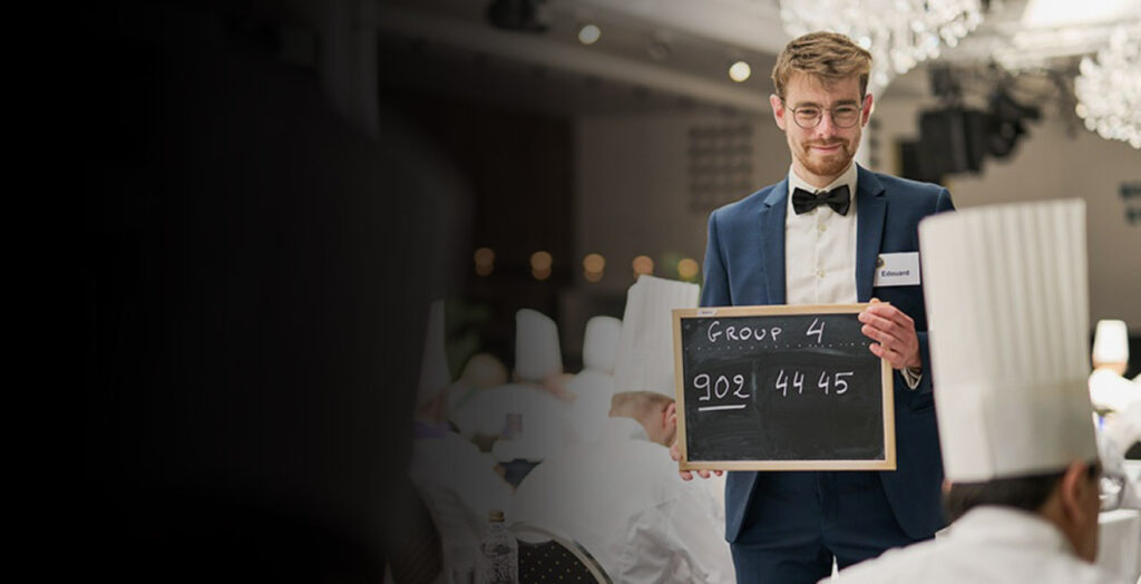 Man holding a sign with a text on it