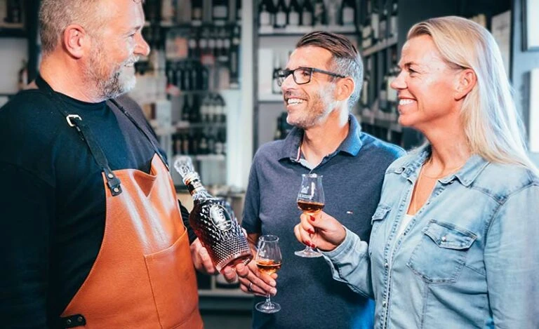 People tasting A.H. Riise Rum